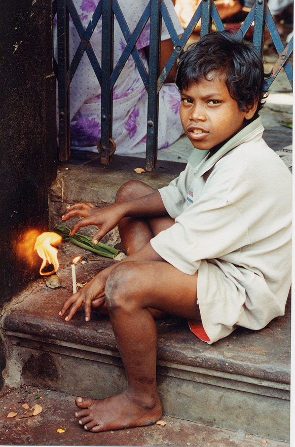 Boy Sitting With Candle, Calcutta / India - Click Image to Close