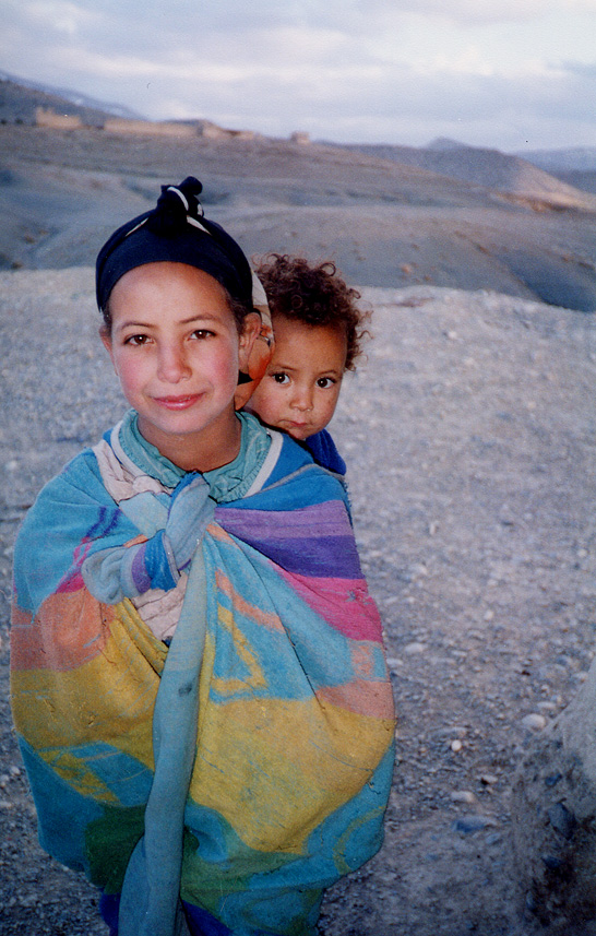 Young Woman Carrying Baby On Back / Morocco / Berber