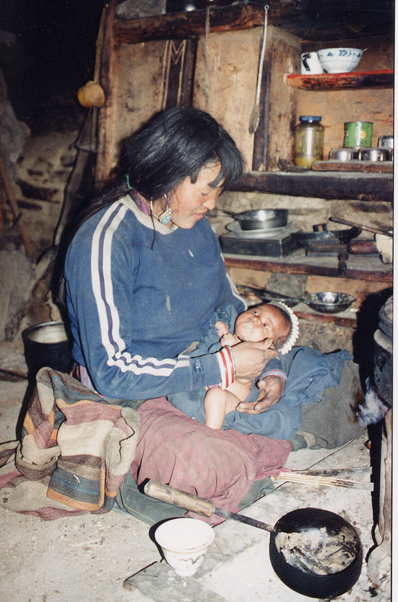 Woman Sitting On Floor With Baby / Nepal / Dolpo - Click Image to Close