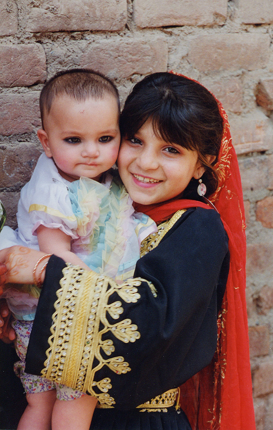 Young Girl In Native Garb Holding Baby / Pakistan / Pushtun - Click Image to Close