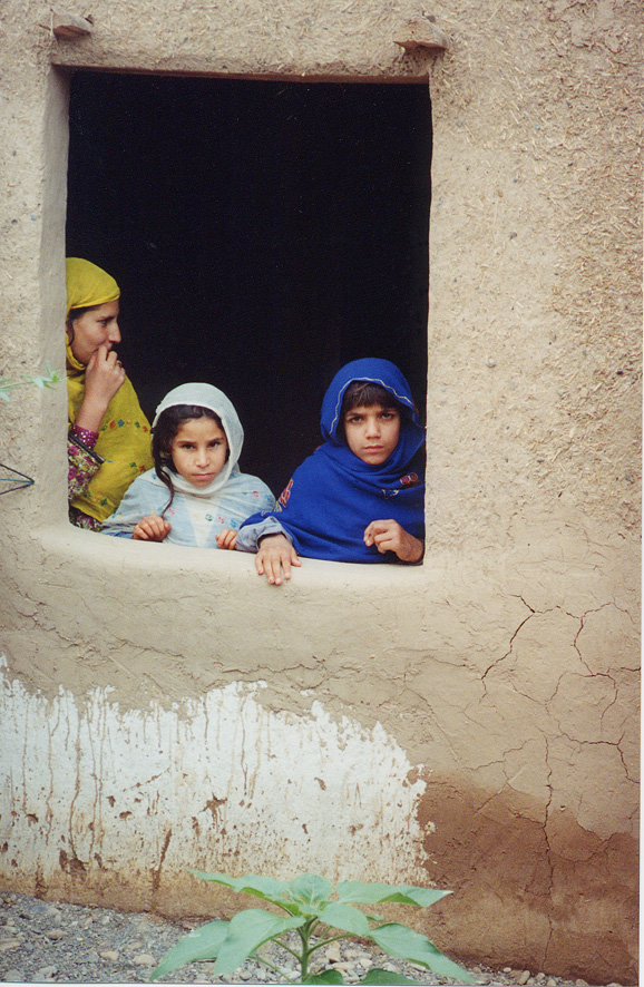 Children Looking Out Of Open Window / Pakistan / Pushtun