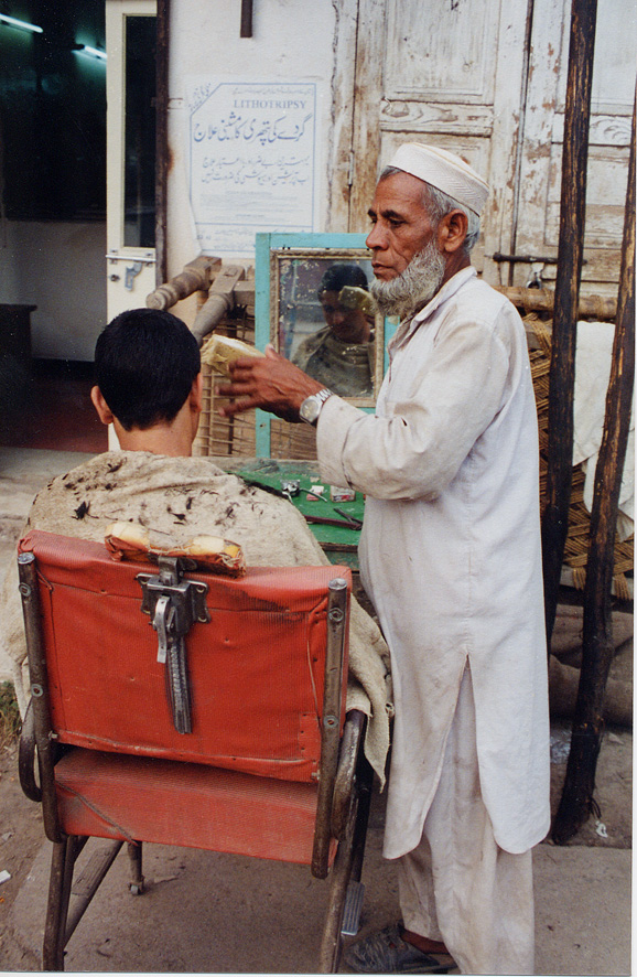 A Barber With A Customer / Pakistan / Pushtun