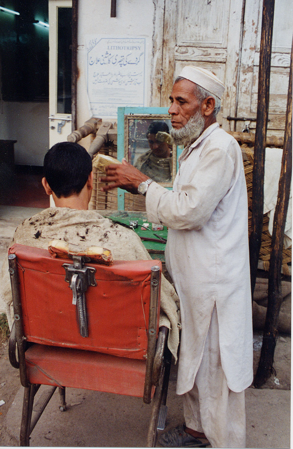 A Barber With A Customer / Pakistan / Pushtun - Click Image to Close