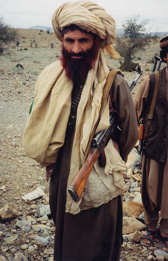 Man With Gun On Countryside / Pakistan / Wazari - Click Image to Close