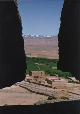 Kasbah With The Atlas Mountains In The Background / Morocco